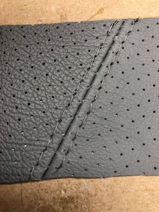 you shouldn't top stitch a perforated leather, the stitching drops in to the perforations and deforms them, and the stitches