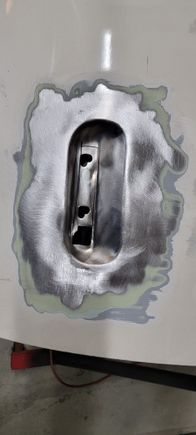 Can see the layers here. Thicker coat of filler than I was expecting. Think once the welding is done, the entire door will need a skim coat and a lot of blocking to get it smooth. 