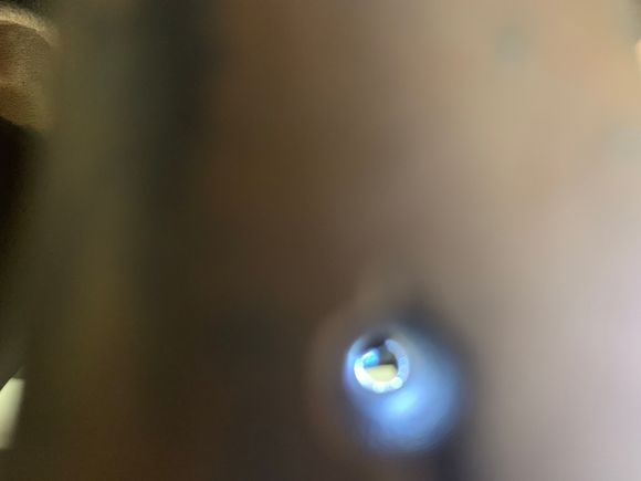 The black you see in the hole is the stud threads.