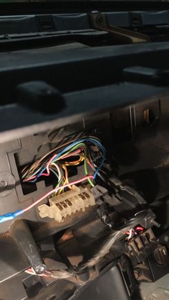 These are the plugs behind the gauge cluster. If you see those two pink wires, one of them isn't connected to anything, and the other one is connected to the plug and goes off to the left and into a blue plug. I was wondering if those two pink wires are actually supposed to be spliced together and if it actually goes to the speedometer or something else. And I wanted to know if anyone had a diagram of where all those wires actually go to.