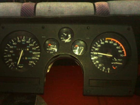 My car originally had the 85 MPH cluster, i bought this cluster from a fellow TGO'r here. This is what it looked like before i gave it some TLC! Dont mind the faded black backseat... That will all be gone soon enough!