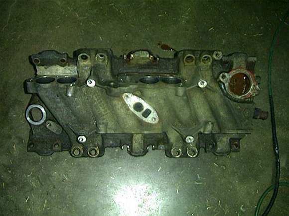 Original 1985 305 intake...Shotty mechanic broke the center bolt holes while installing on the newer style L98 engine.  (Should have been elongated.)