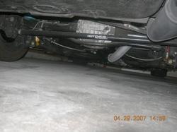 Reduced polar of the typical heavy long third gen exhaust and muffler routing. Current rearend pic- also shows pahard axle side adjuster bracket