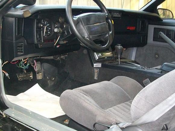 the inside as it sit now..98 trans am grey cloth,grey plastics,91 door panels,black carpets,headliner,and center console carpet