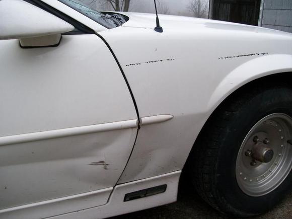 Whoever keyed the PO was PI$$ED! The scratch goes into the body in some places. Notto metion the 'bang' in the door/quarter panel.