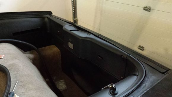 Refitting of the rear panels after painting and new carpet fitments.