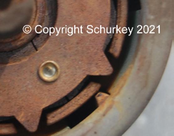 Magnet cracked on either side of the riveted area.