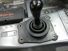 The stock bellows is damn near at the perfect height and only about 3/4" further back than the stock location. Shift knob is now not accurate because it's a 5 speed instead of 6. 
