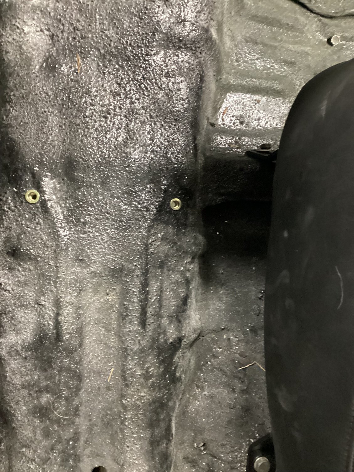 6mm Rivnuts installed in the floor to bolt the console to. 