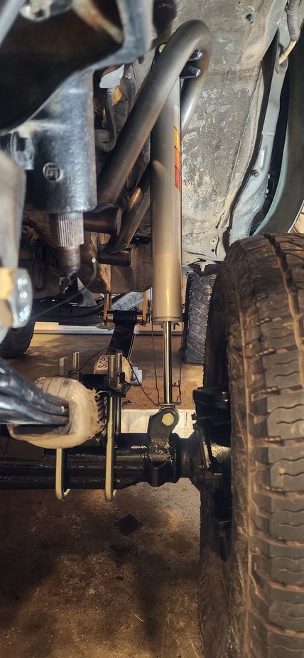 Shock hoops tacked up. Paper says to install with 40% of shock length exposed. I used rebar tie wire to set my length before i set it in position. However with the length set to what they recommend the shock hoop would not land completely on the frame. I pulled it back out and extended 1/2