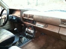 Interior was decent. The famous cracked dash is already installed so that's good. Disgusting shift boot cover. Racing steering wheel. Horribly wired cd player... Nice guage cluster. Few burned out bulbs and stuff...