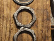 Same thing as the other side. The nuts appeared to have gotten in a fight with a flat head screwdriver in a previous life. Filed the burs down just get rid of any sharp edges.