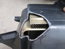 Had the basic relief shape cut into the housing to make way for the new fire wall shape while still allowing it to mount in its original position with the heater core and blower motor.  Now it was onto the core.