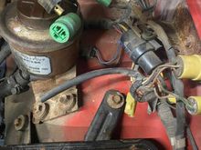 4 lonely plugs in this photo at 12, 5 and (2) at 10 o'clock, guessing at least 2 are for coil and igniter.