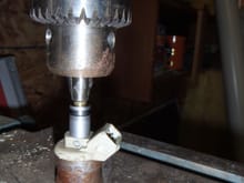 using drill press to install screen filter in injector