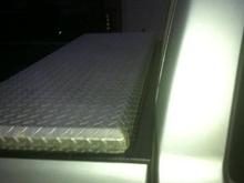 When I first got the truck the toolbox was too far up and it would hit against the back of the cab, and not open all the way.  When I got around to scooting it back, there was a little bit of a gap in the bed.