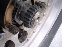 MM hub on axle shaft before machining. I decided to have a machine shop shave the gear down so at least the snap ring groove was accessable, roughly the thickness of the snap ring.