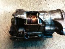This was a starter.  It was invading the personal space of the conecting rod, so it was tought a lesson.