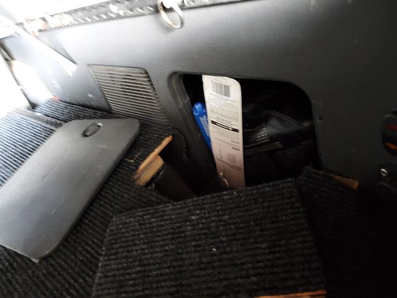 passenger's side cubby is accessible by popping up a small wooden access piece. I may had a set of hinges at some point