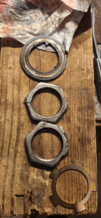 Same thing as the other side. The nuts appeared to have gotten in a fight with a flat head screwdriver in a previous life. Filed the burs down just get rid of any sharp edges.