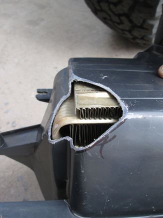 Had the basic relief shape cut into the housing to make way for the new fire wall shape while still allowing it to mount in its original position with the heater core and blower motor.  Now it was onto the core.