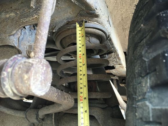 8.5" on fatigued factory spring under load.