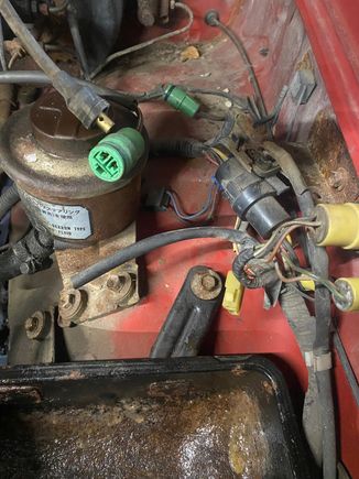 4 lonely plugs in this photo at 12, 5 and (2) at 10 o'clock, guessing at least 2 are for coil and igniter.