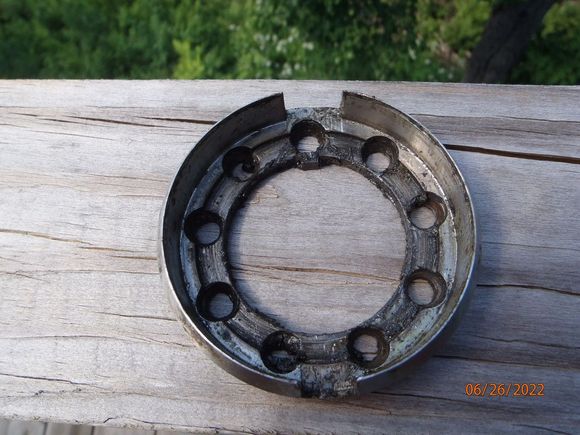 the lock plate.  note the tab on the inner circumference.  that tab rides in the slot in the spindle shaft.  the slot is at the 12 o'clock position from the factory