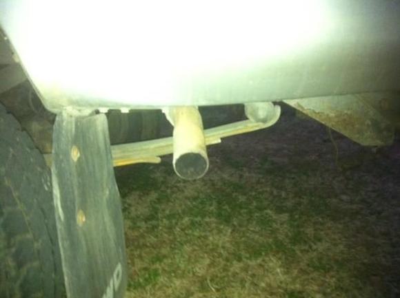 Stock exhaust system.  It's leaking at the moment, and when I sit with it cranked you can smell exhaust coming into the cab.  Going to get that fixed within the next 2 weeks.