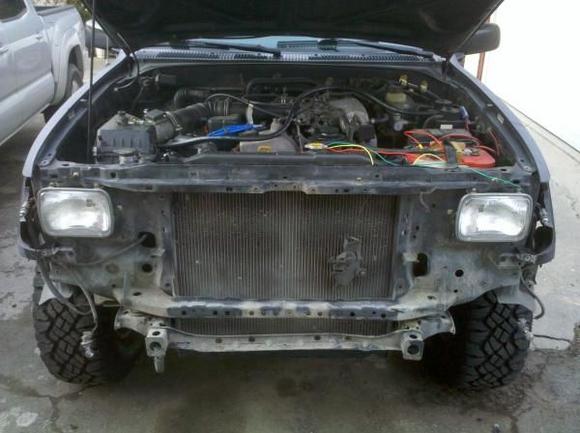Front end off. Old radiator support to 01-04. Got into working mode and stop taking pictures lol. Dont mid the wiring quick job to get my electric fans going.