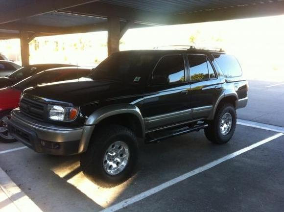 two tone stock paint, changed lights, black nerf bars, blacked out grille