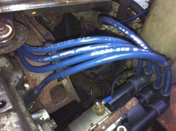 I replaced the battery, plugs, plug wires, distributor cap and rotor, points, air and fuel filters, then gave it an oil change. Then she started right up, runs like a champ.