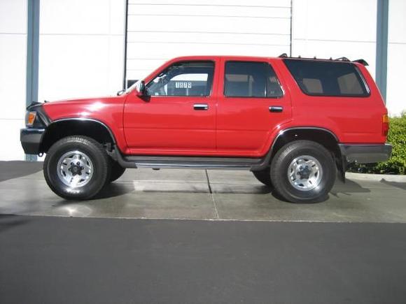 clean &amp; shiny!

Although she was kept in the garage most of her life, I used finish restorer and a clay bar to clean her up and restore her shine.   Now I just use Nanowax ($4, blue spray bottle.. carnuba wax) and a microfiber pad to do the once-over every month or so after a washing.

I never really need to "wash" the Runner here in San Jose.  It just gets dusty once in a while.  It never really rains, snows, or anything.. just road grime, really.  A quick spray with the hose and a wipe down.   

Nothing like Michigan.  Or Portland, for that matter....   but once in a while during late summer I will have to wipe off the ash from whatever fire is burning in the mountains surrounding Silicon Valley.  I keep her in a lighted carport behind a gated condo community.