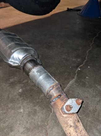 Welded together and attached to the stock exhaust.  That is the old single O2 sensor bung blocked off, new one is welded on post the 2 new cats (done before this little project)