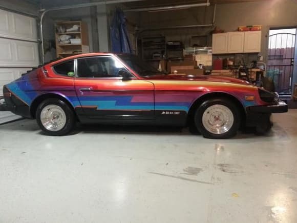 Bought this car off my manager he had it sitting for 12 years. Not running and had this funky paint job. Every color is a candy color. Now she is running smooth.