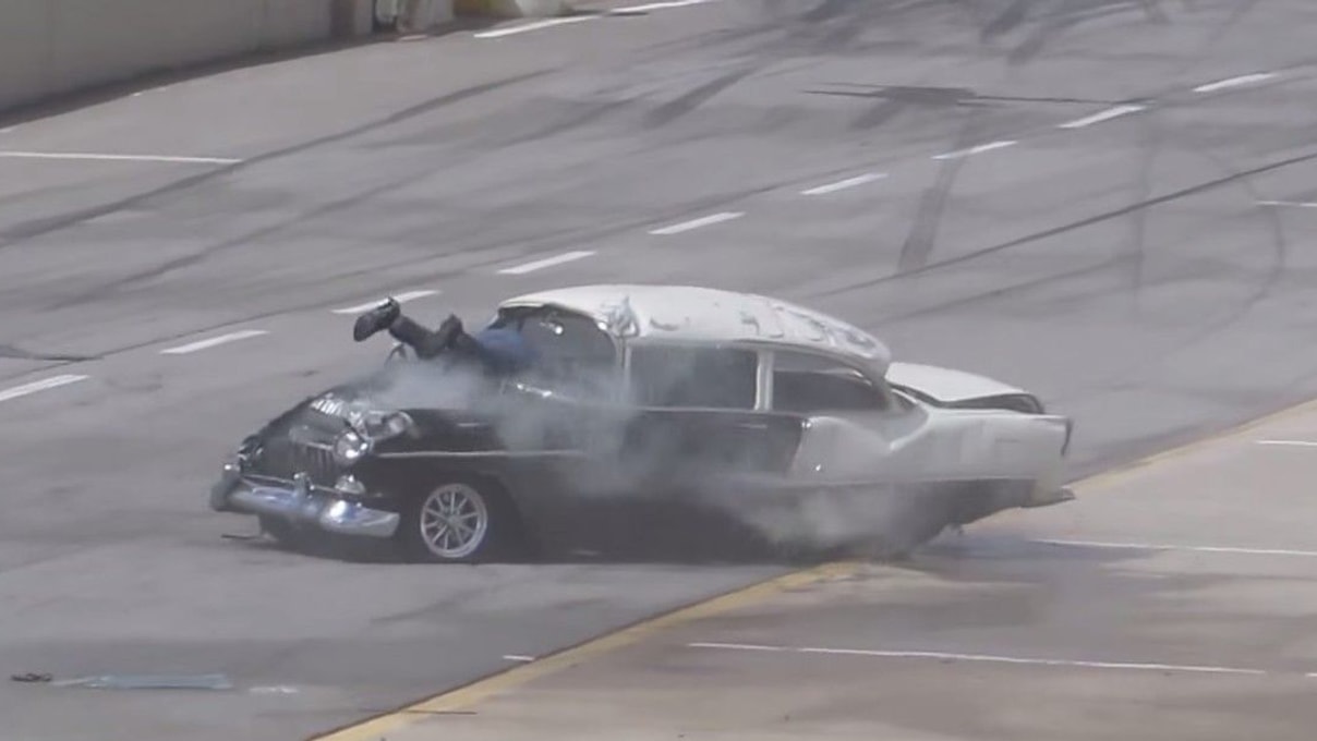 1955 Chevy crashes on the drag strip, ends with driver's legs sticking out windshield