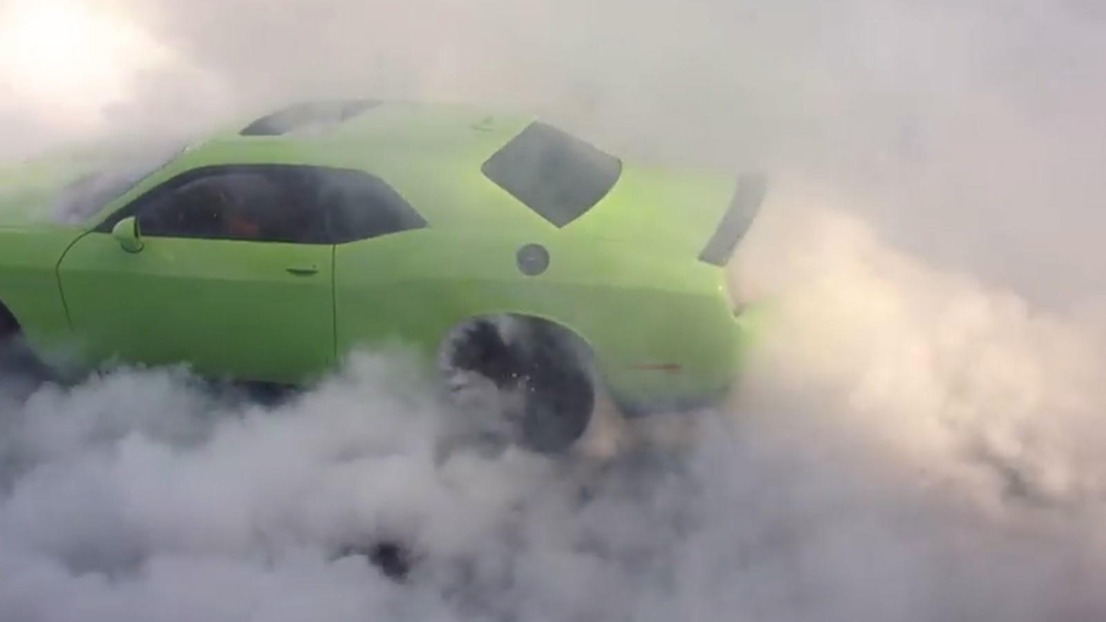 Ralph Gilles does a burnout in the 2015 Dodge Challenger SRT Hellcat