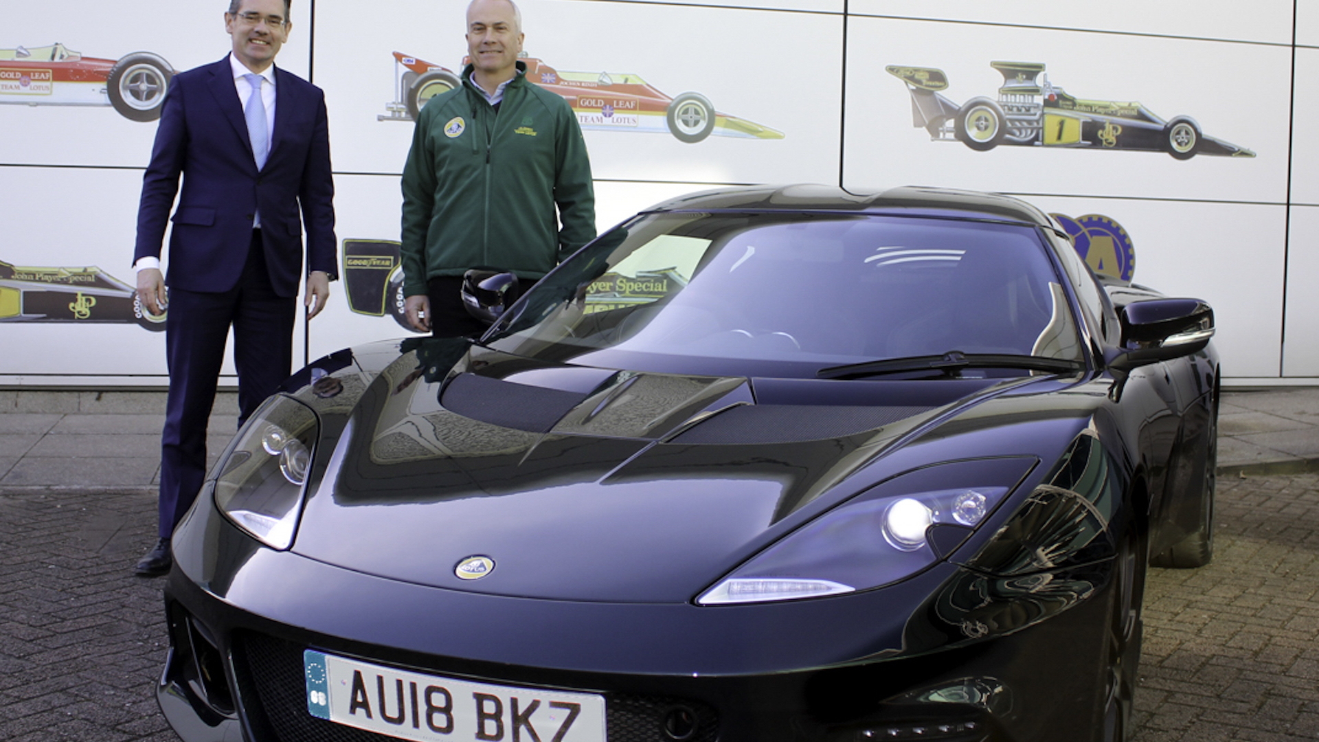 Lotus CEO Jean-Marc Gales (left) hands Clive Chapman the keys to a 2018 Lotus Evora GT410 Sport
