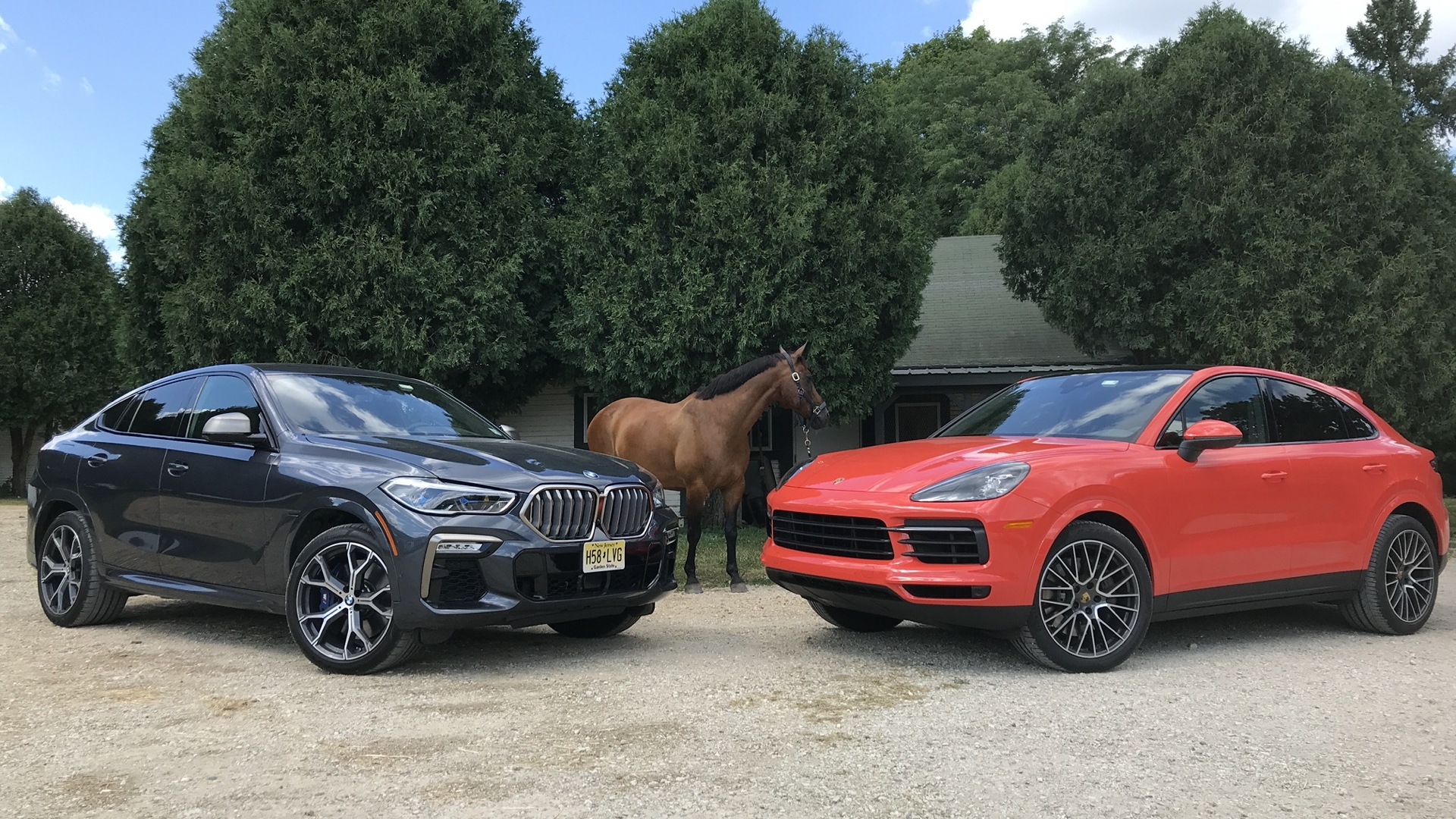 2020 BMW X6 M50i, left, and 2020 Porsche Cayenne Coupe S, right