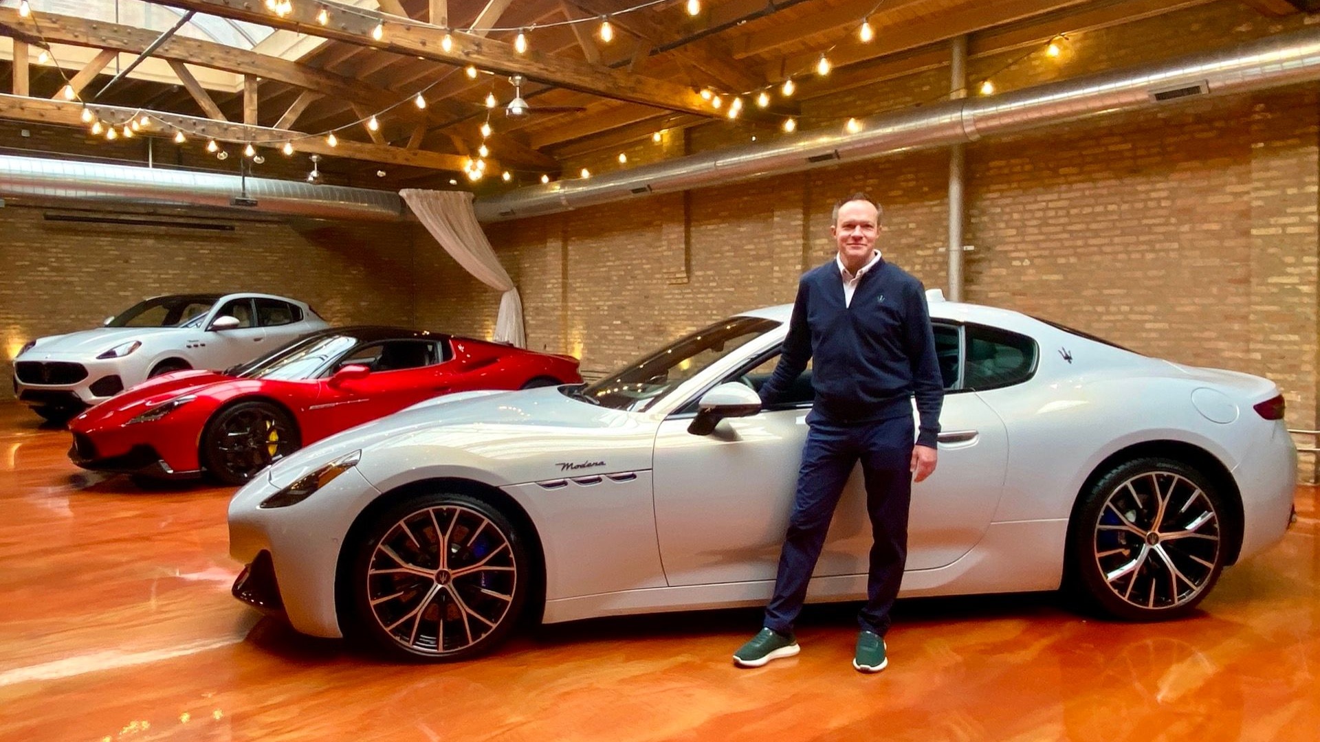 Bill Peffer, CEO of Maserati Americas, poses beside the 2024 Maserati GranTurismo