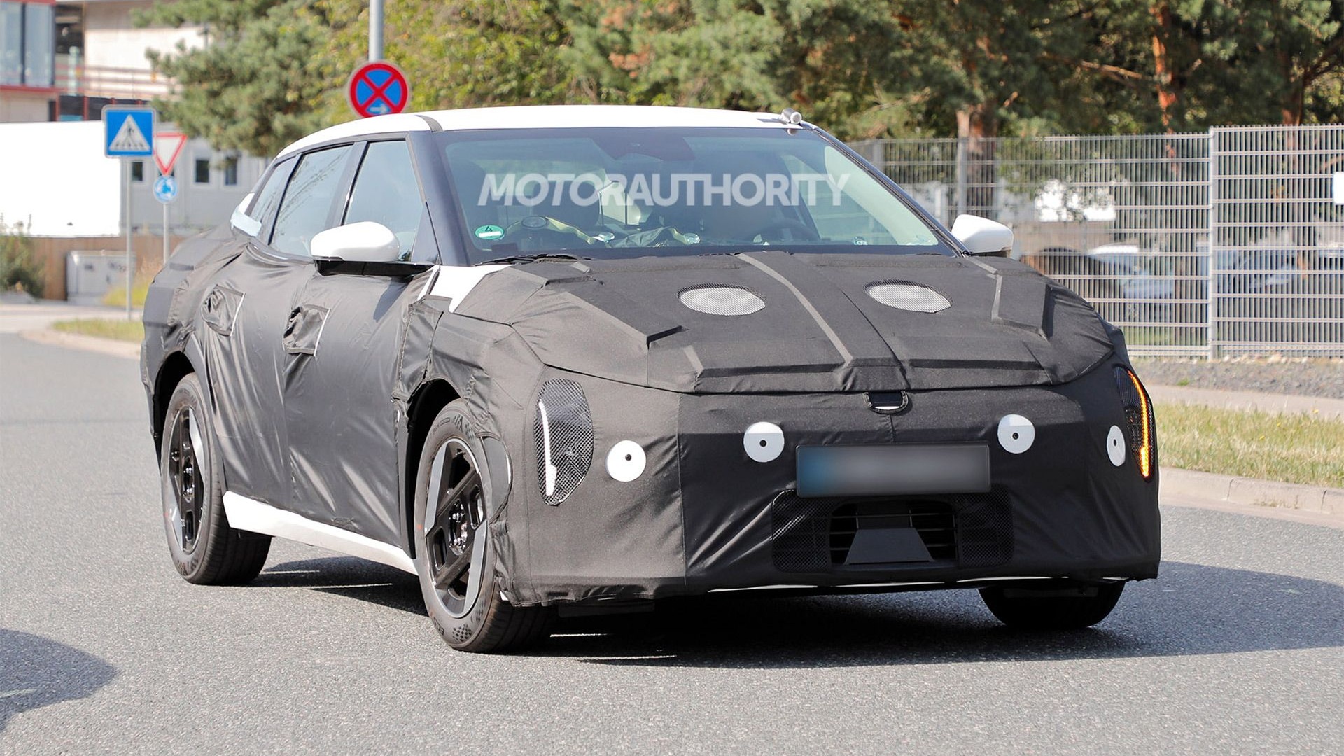 2026 Kia EV4 spy shots - Photo via Baldauf