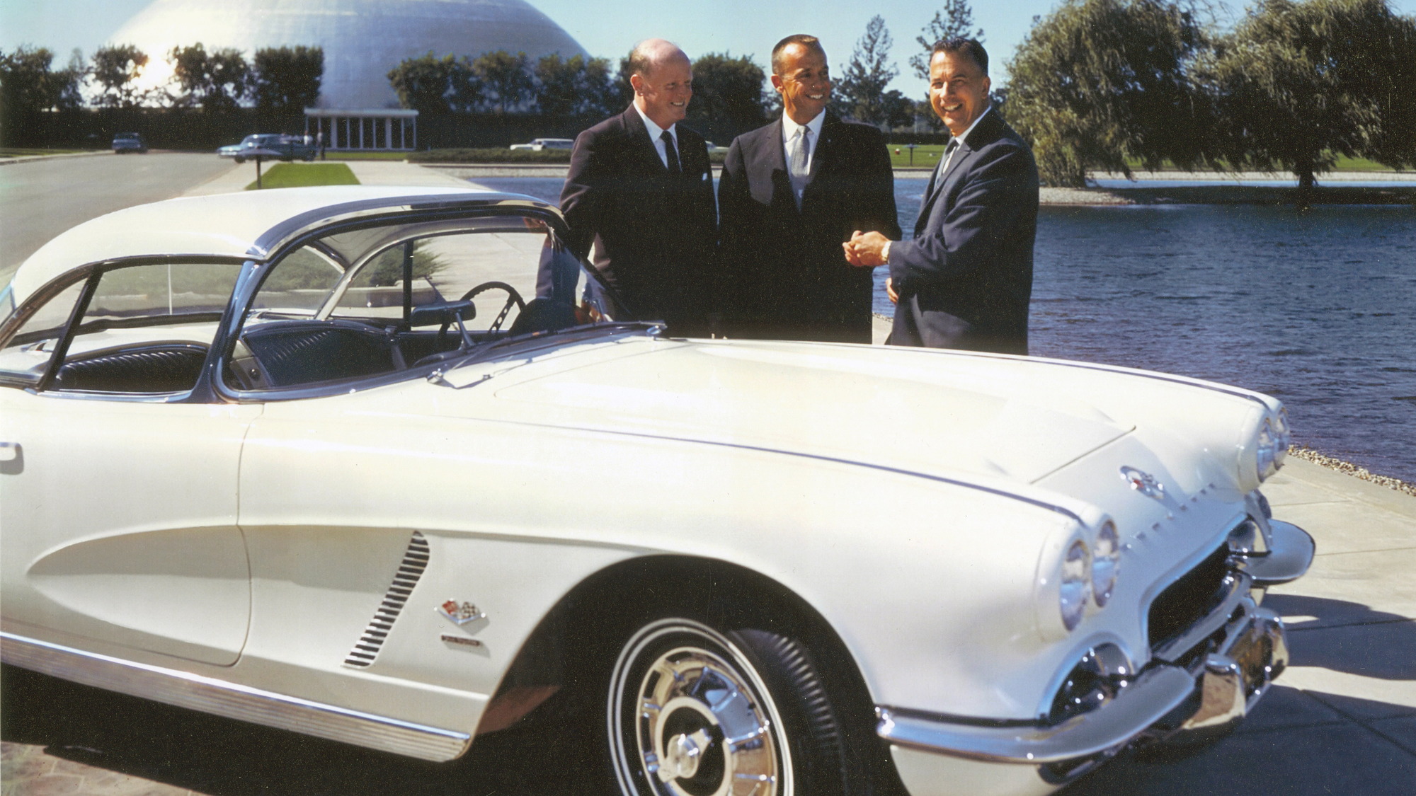 Astronaut Alan Shepard (center) with GM reps and his 1962 Corvette