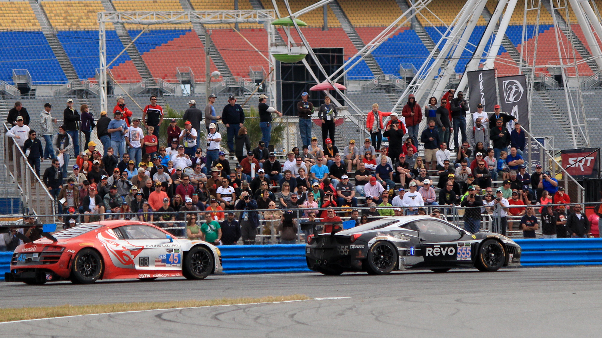 Winkelhock an Guidi battle for position at the end of the 2014 Rolex 24 at Daytona