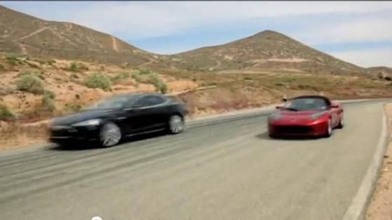 Tesla all-electric Model S sedan and Roadster sports car shown together on video