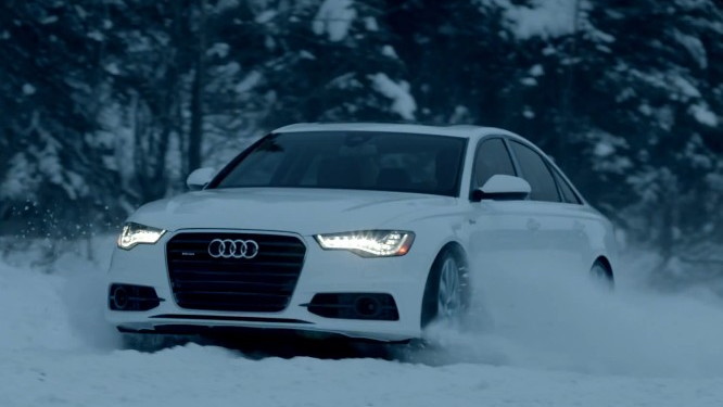 Audi's A6 quattro plays in the snow.