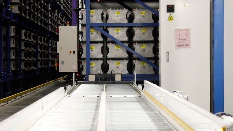 Lithium-ion cells travel down a conveyor after aging process at Nissan cell plant in Smyrna, TN